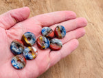 7 Chakra crystal donut pendant with pi stone, 20mm gemstone featuring vibrant chakra colors and intricate detailing.