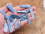 Raw kyanite gemstone from GemstoneGO featuring deep blue, natural crystal formation with rough texture and crystalline structure.