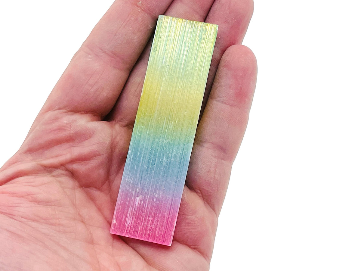 Rainbow Aura Selenite wand from GemstoneGO, raw gemstone stick in various lengths, showcasing iridescent rainbow hues.