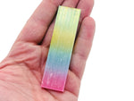 Rainbow Aura Selenite wand from GemstoneGO, raw gemstone stick in various lengths, showcasing iridescent rainbow hues.