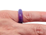 Amethyst crystal ring by GemstoneGO featuring a large purple gemstone set in a silver band, close-up view of the jewelry.