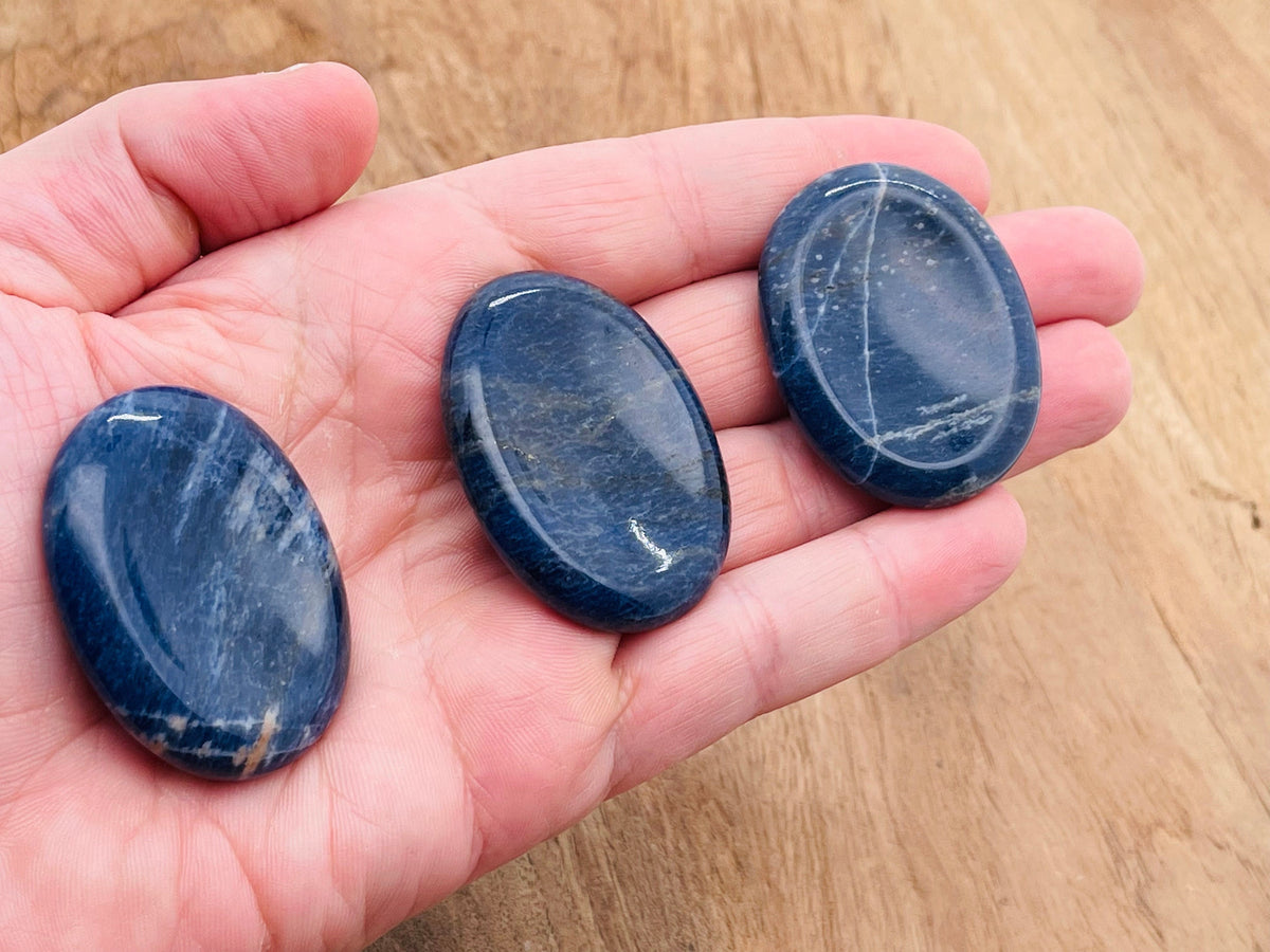 Sodalite worry stone from GemstoneGO, measuring 4.5x3.5cm, featuring smooth polished blue and white gemstone for calming use.