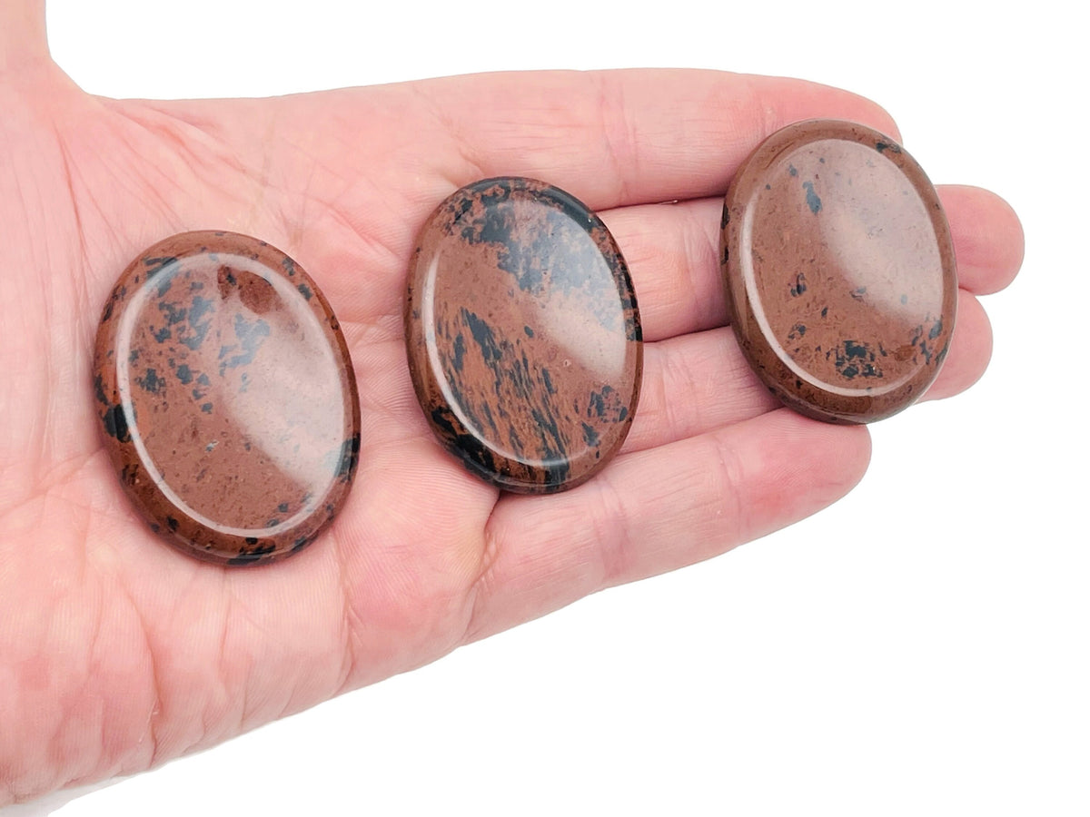 Mahogany Obsidian worry stone from GemstoneGO, smooth 4.5x3.5cm crystal for soothing stress relief and meditation.