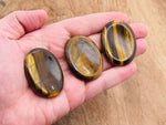 Tiger Eye worry stone from GemstoneGO, 4.5x3.5cm, smooth polished crystal for stress relief and calming rituals.
