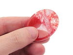 Cherry Quartz worry stone from GemstoneGO, 4.5x3.5cm soothing crystal with polished, smooth surface for stress relief.