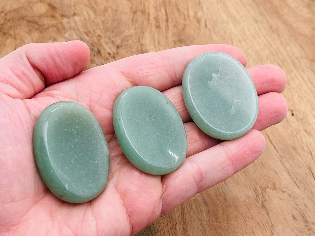 Aventurine worry stone from GemstoneGO, smooth 4.5x3.5cm crystal for stress relief and calming energy, shown in close-up.
