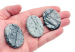 Black Network Jasper worry stone with smooth surface, measuring 4.5x3.5cm, from GemstoneGO featuring intricate natural patterns.
