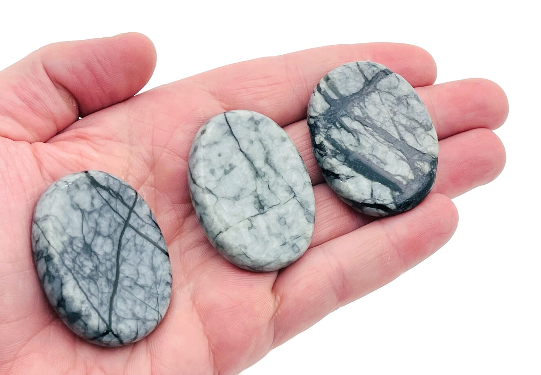 Black Network Jasper worry stone with smooth surface, measuring 4.5x3.5cm, from GemstoneGO featuring intricate natural patterns.