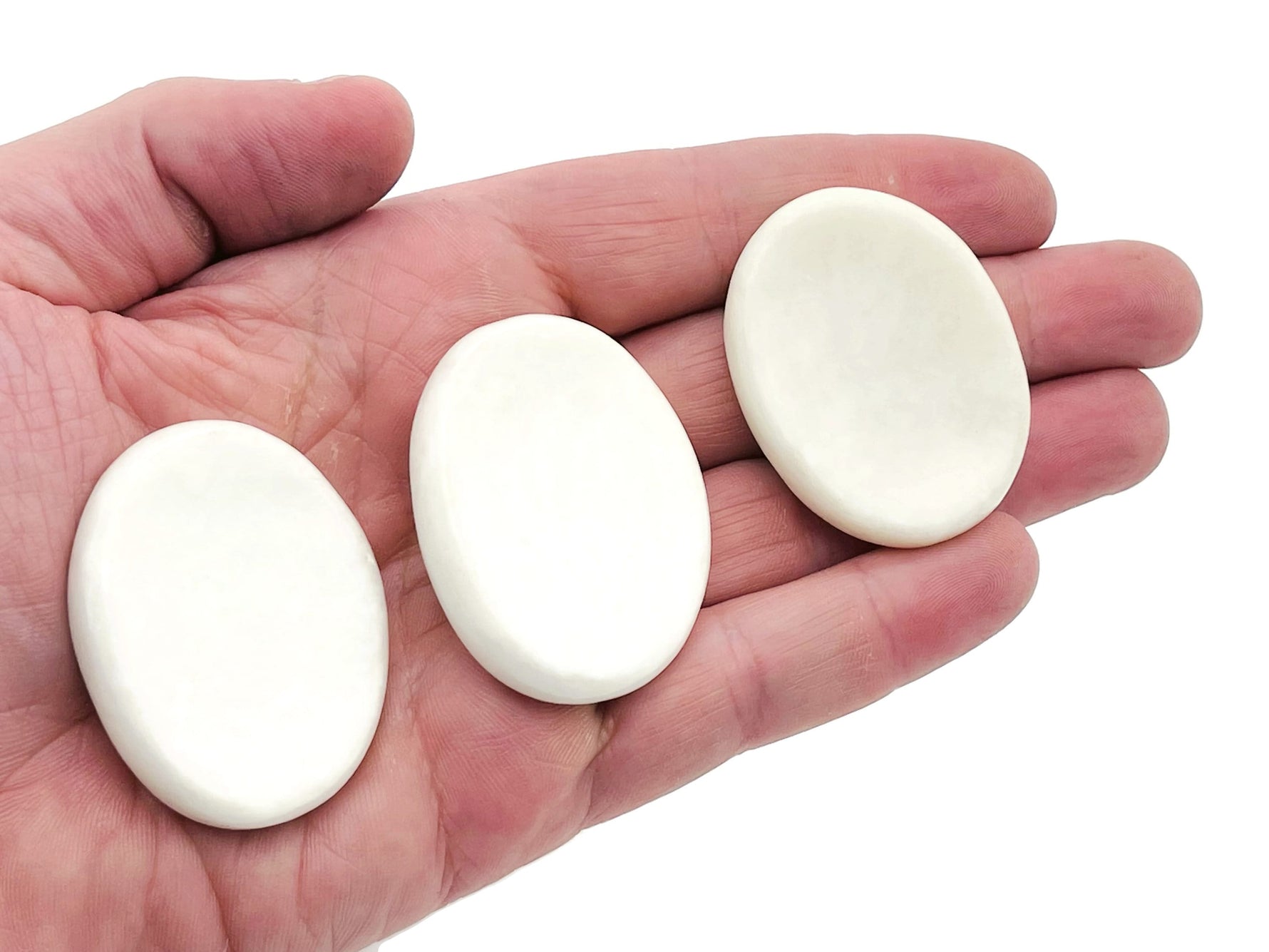 White jade worry stone from GemstoneGO, 4.5x3.5cm soothing crystal with polished smooth surface for stress relief.