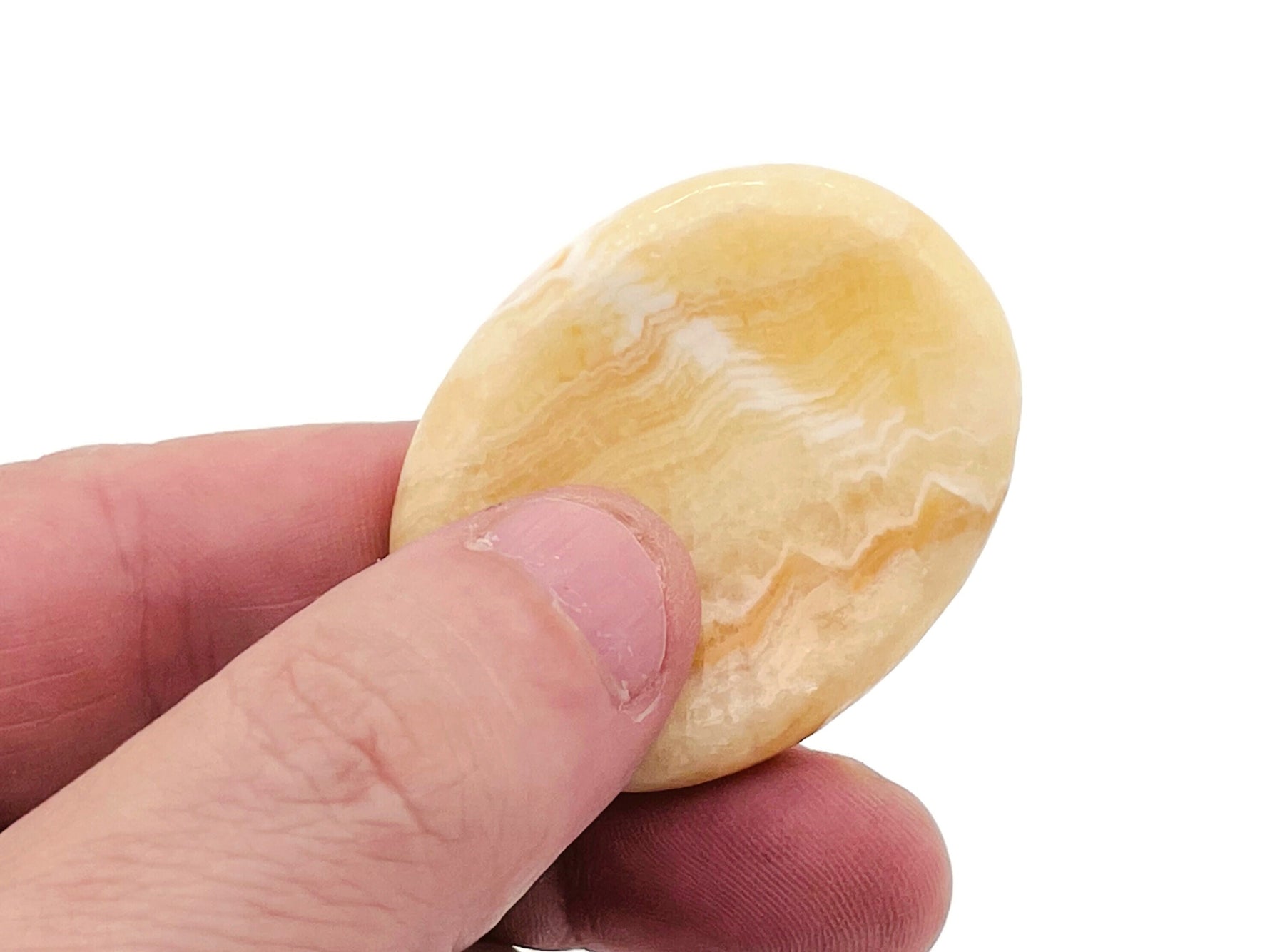Yellow calcite worry stone from GemstoneGO, 4.5x3.5cm soothing crystal for stress relief and meditation.