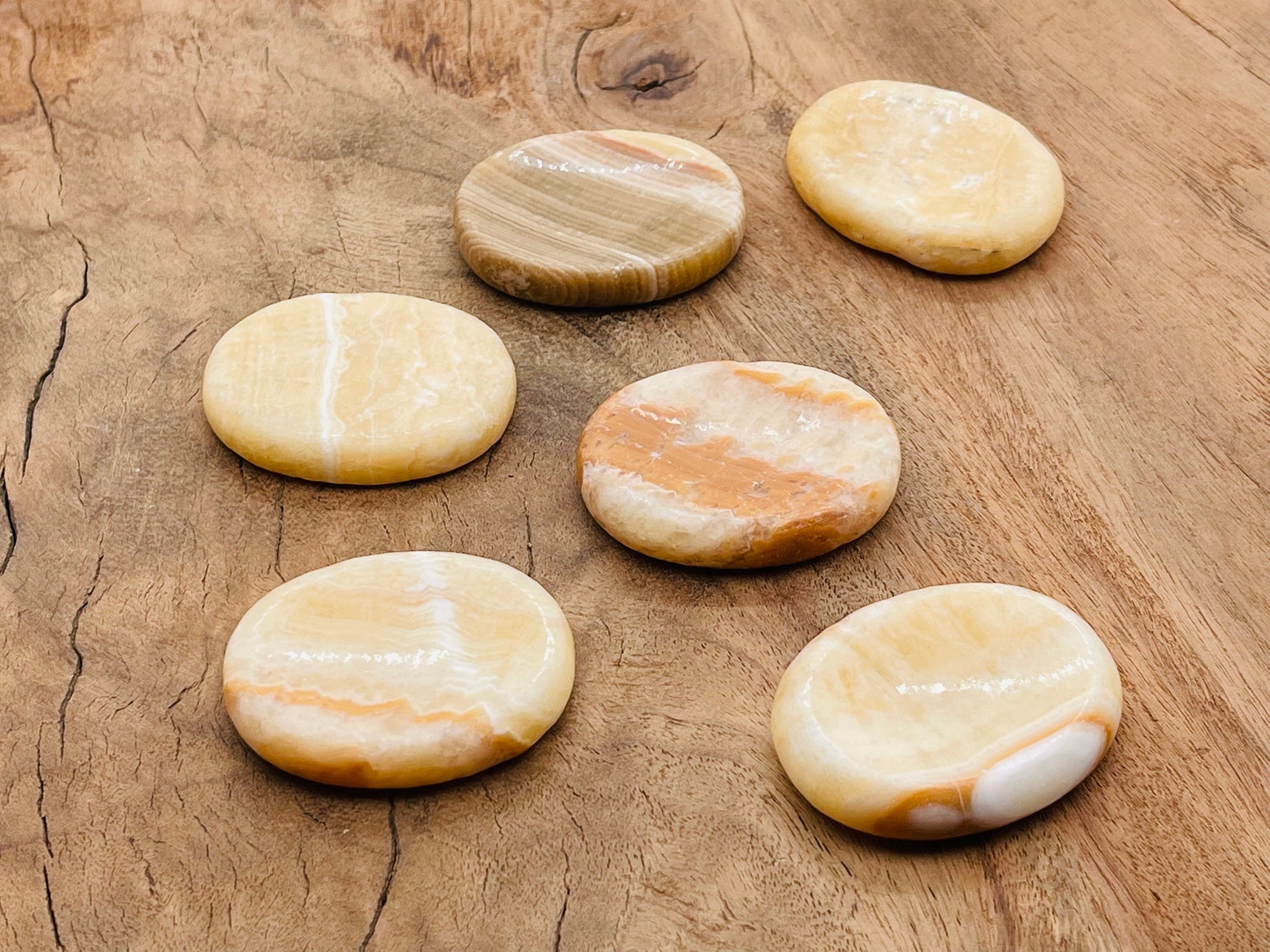 Yellow calcite worry stone from GemstoneGO, 4.5x3.5cm, smooth polished crystal for stress relief and calming energy.