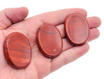 Red Jasper worry stone from GemstoneGO, 4.5x3.5cm, featuring smooth, polished red jasper crystal for calming and stress relief.