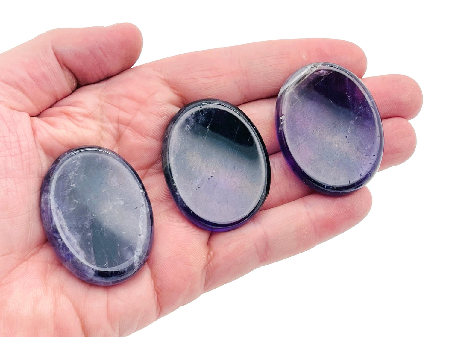 Amethyst worry stone from GemstoneGO showing smooth purple crystal with rounded edges, measuring 4.5x3.5cm for stress relief.
