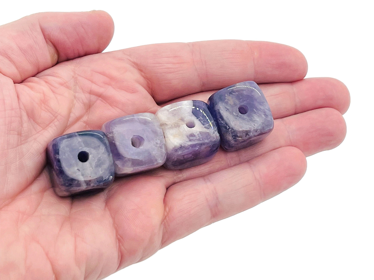 Handmade amethyst crystal incense holder with carved design, featuring a stone base for incense sticks.