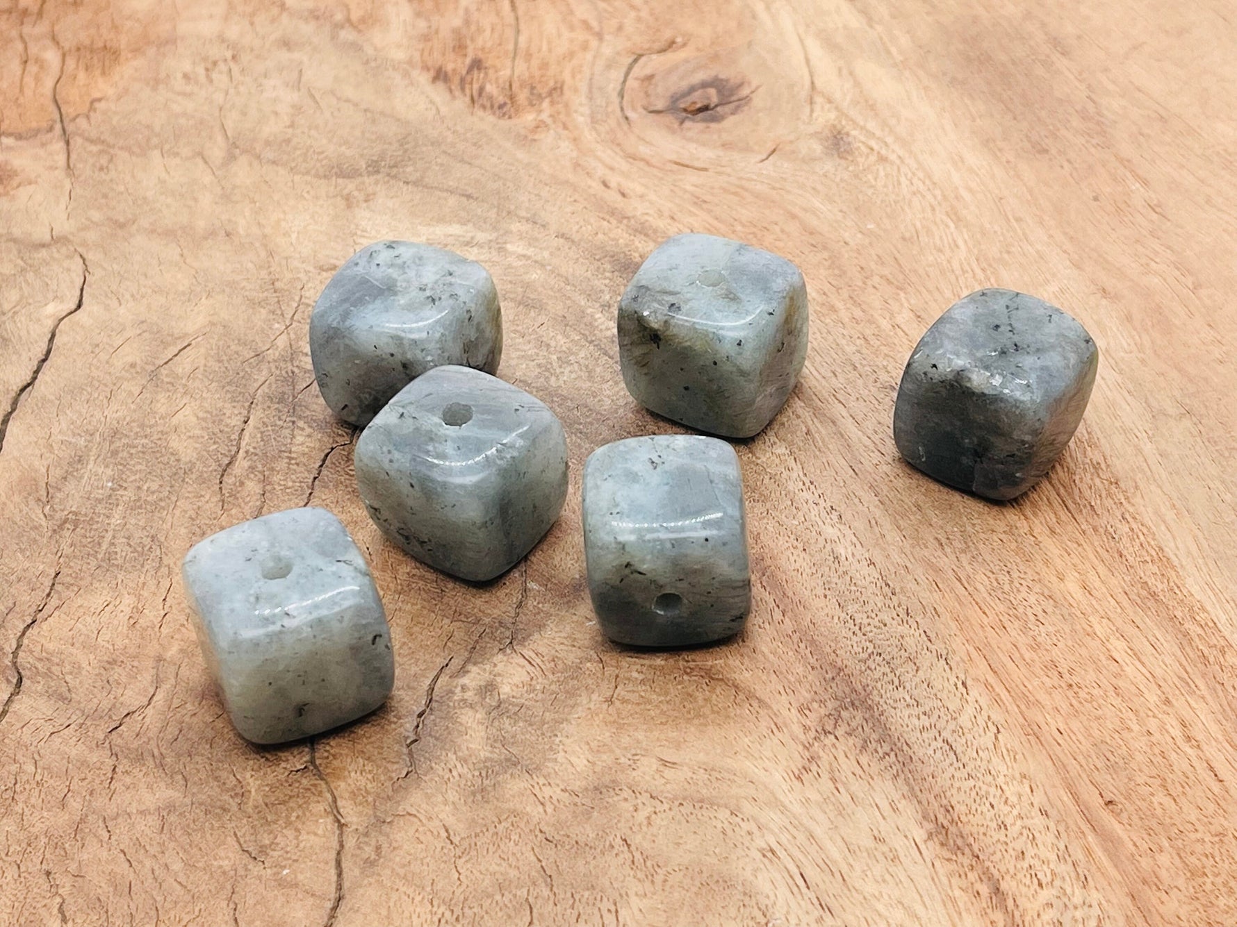 Handmade Labradorite crystal incense holder with carved design, showcasing natural stone’s iridescent blue and green hues.