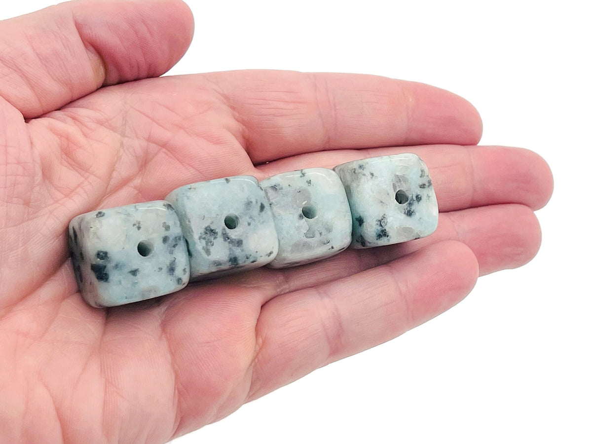 Handmade Kiwi Jasper crystal incense holder with carved design, featuring a stone surface and space for incense sticks.