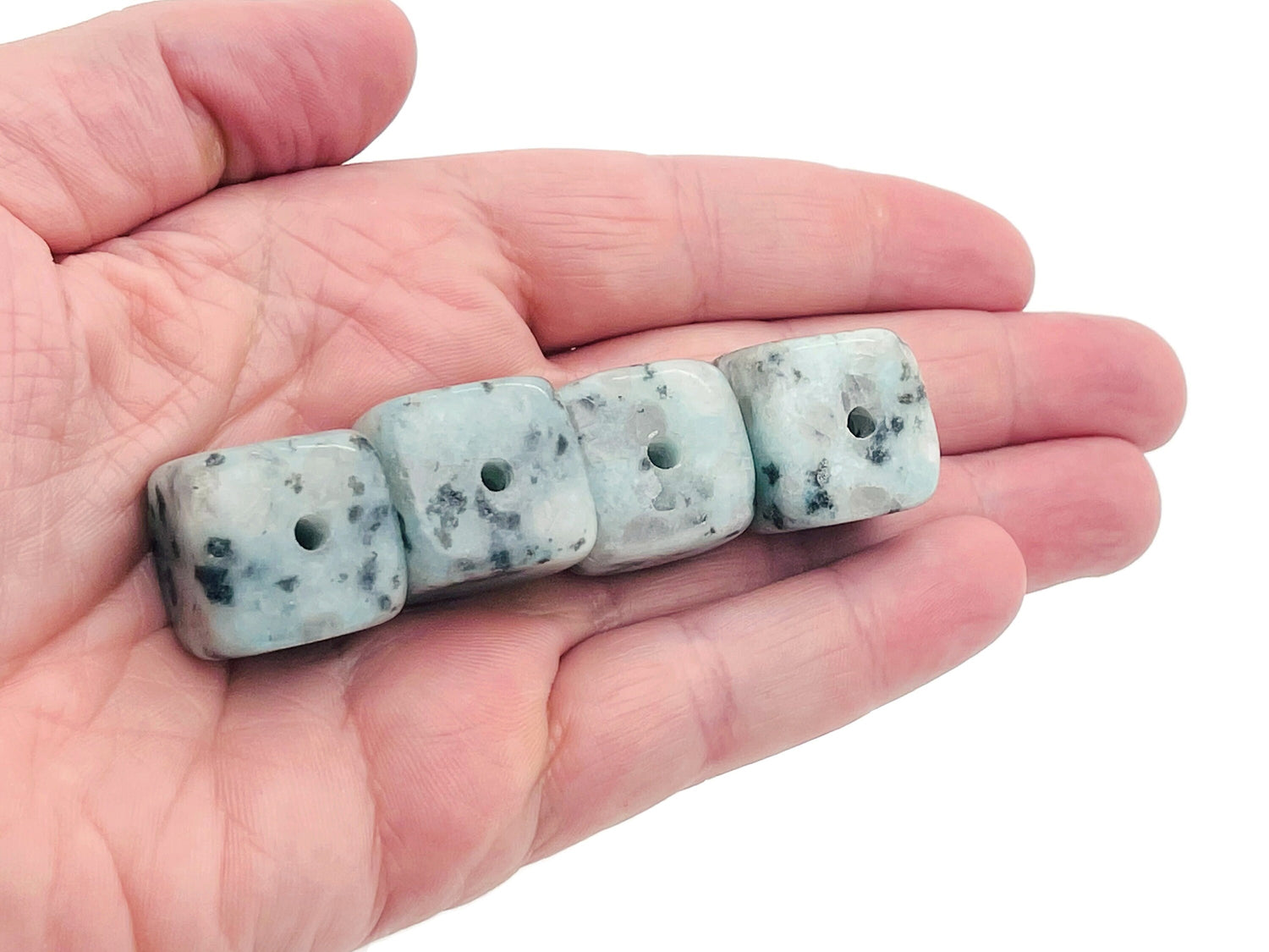 Handmade Kiwi Jasper crystal incense holder with carved design, featuring a stone surface and space for incense sticks.
