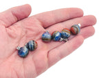 Chakra crystal pendant featuring seven stones on a silver chain, designed for energy balancing and spiritual healing by GemstoneGO.