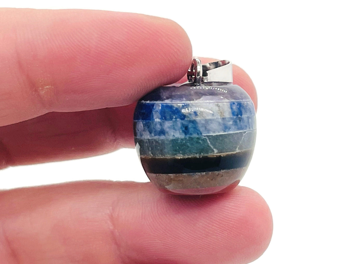 Chakra Apple Crystal Pendant with seven stones from GemstoneGO, showcasing a polished apple-shaped crystal with colorful chakra stones.