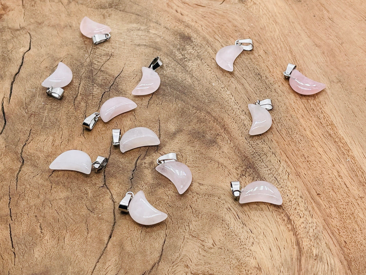 Rose quartz moon crystal pendant from GemstoneGO, featuring a polished pink gemstone in a moon shape for jewelry making.