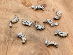 Dalmatian Jasper moon-shaped crystal pendant from GemstoneGO, ideal for jewelry making, featuring distinctive black spots on beige stone.