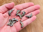 Dalmatian Jasper moon crystal pendant by GemstoneGO, showcasing a polished gemstone with distinctive black spots, ideal for jewelry making.