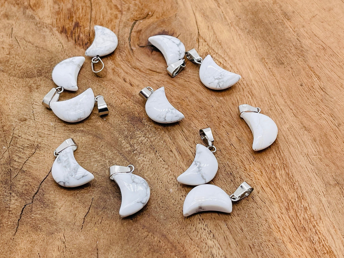 Howlite moon crystal pendant from GemstoneGO, showcasing a polished white gemstone with moon shape for jewelry making.