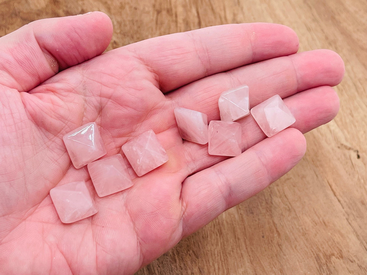Rose Quartz pyramid gemstone carving, 14mm, from GemstoneGO, showing a polished pink quartz pyramid with intricate detailing.