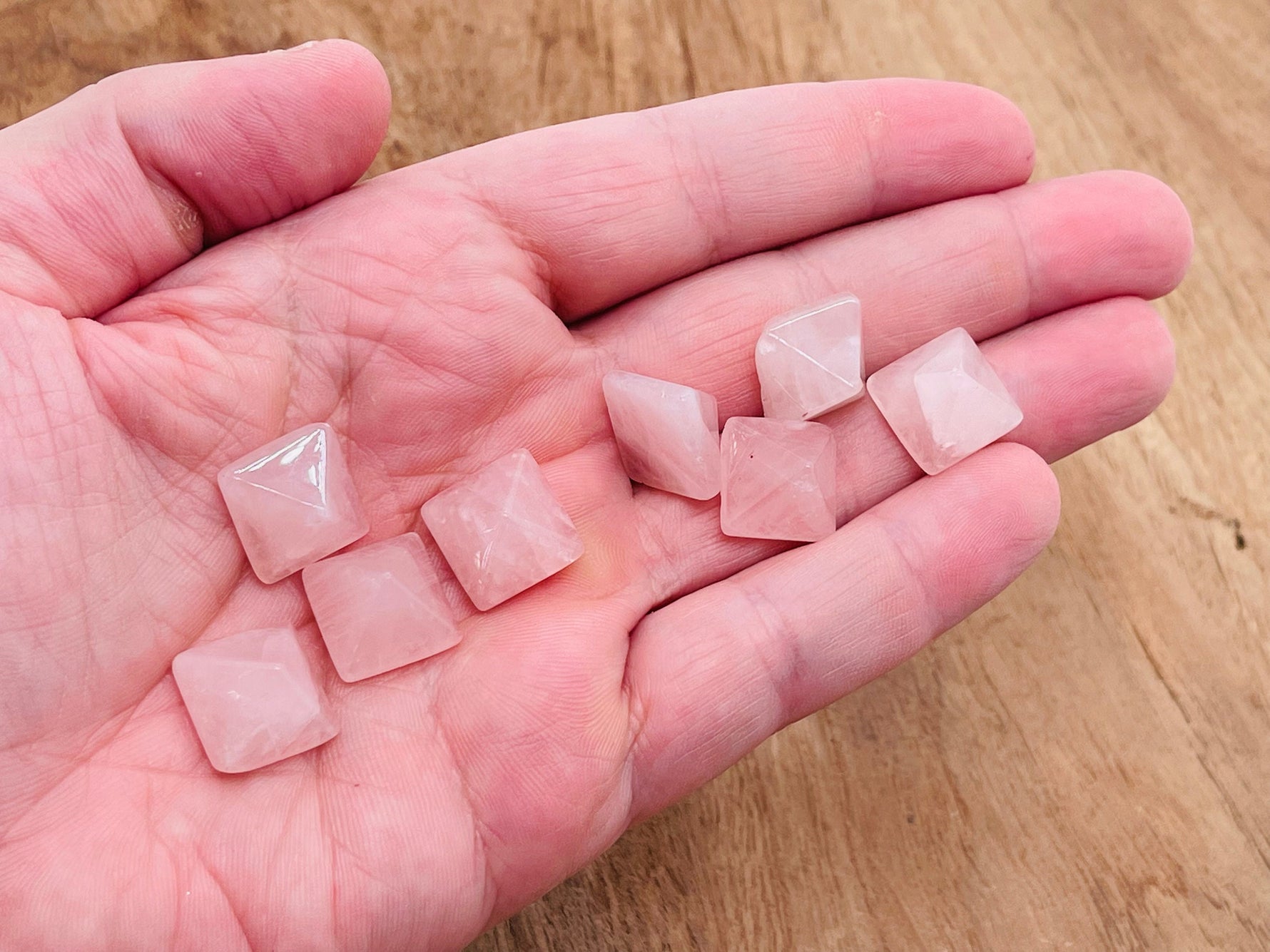 Rose Quartz pyramid gemstone carving, 14mm, from GemstoneGO, showing a polished pink quartz pyramid with intricate detailing.