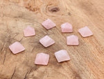 Pink rose quartz pyramid gemstone carving, 14mm size, from GemstoneGO, showcasing smooth polished surface and natural gemstone details.
