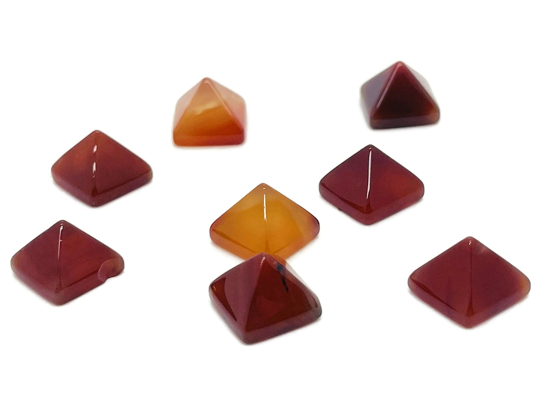 14mm Carnelian pyramid gemstone carving by GemstoneGO, showcasing a vibrant orange-red polished pyramid shape.