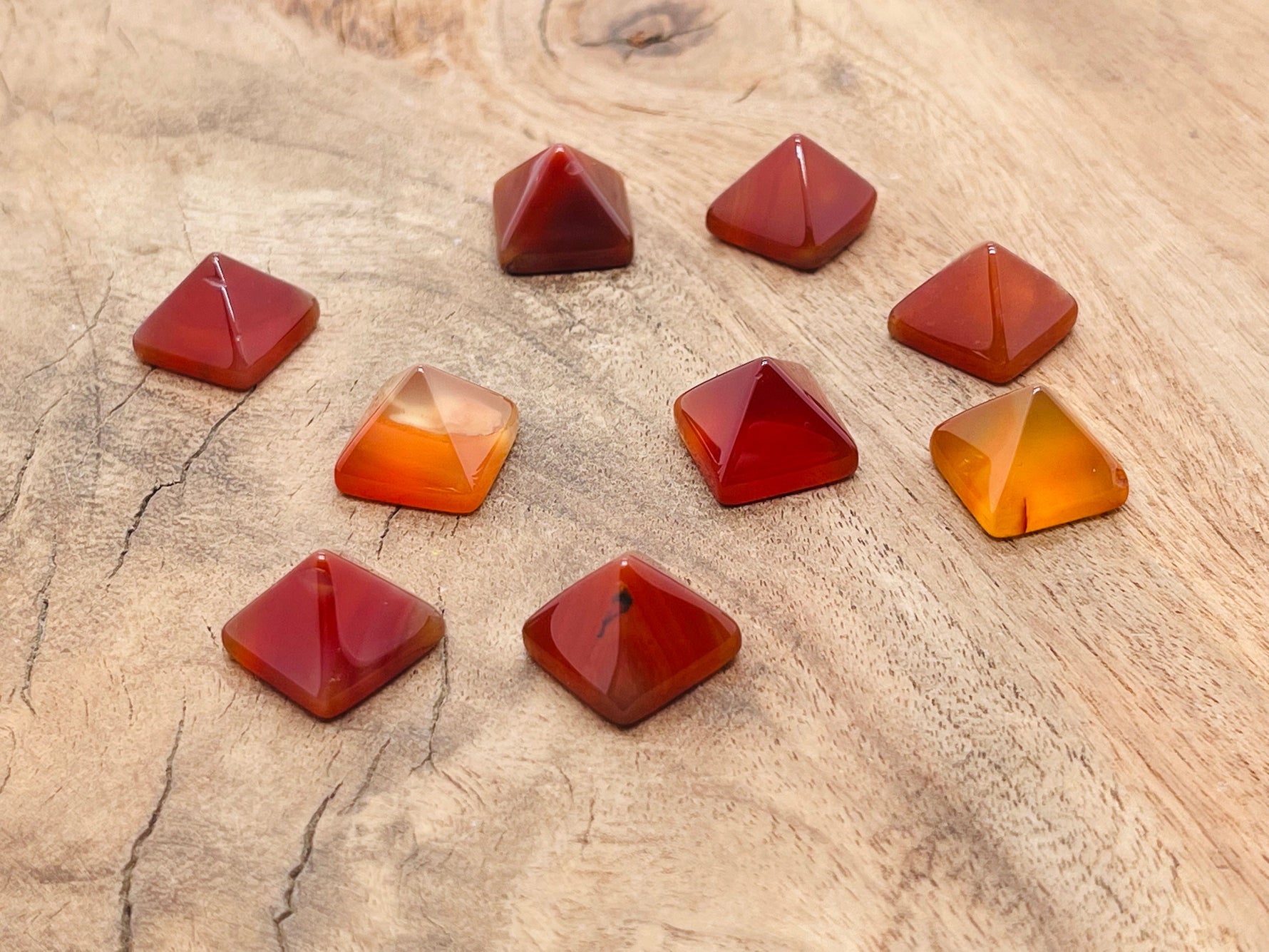 14mm Carnelian pyramid gemstone carving by GemstoneGO, showcasing a rich orange-red polished pyramid shape.