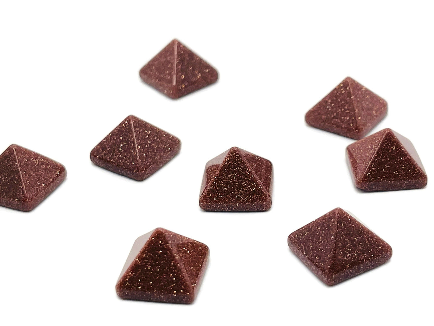 14mm Goldstone pyramid gemstone carving by GemstoneGO, showcasing a shimmering brown and gold-colored pyramid-shaped stone.