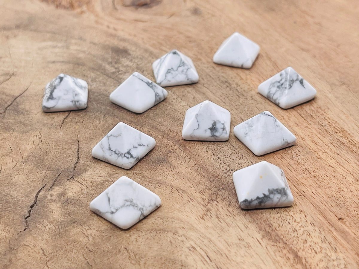 14mm Howlite pyramid gemstone carving by GemstoneGO, featuring a smooth white stone with gray veining and a pointed pyramid shape.