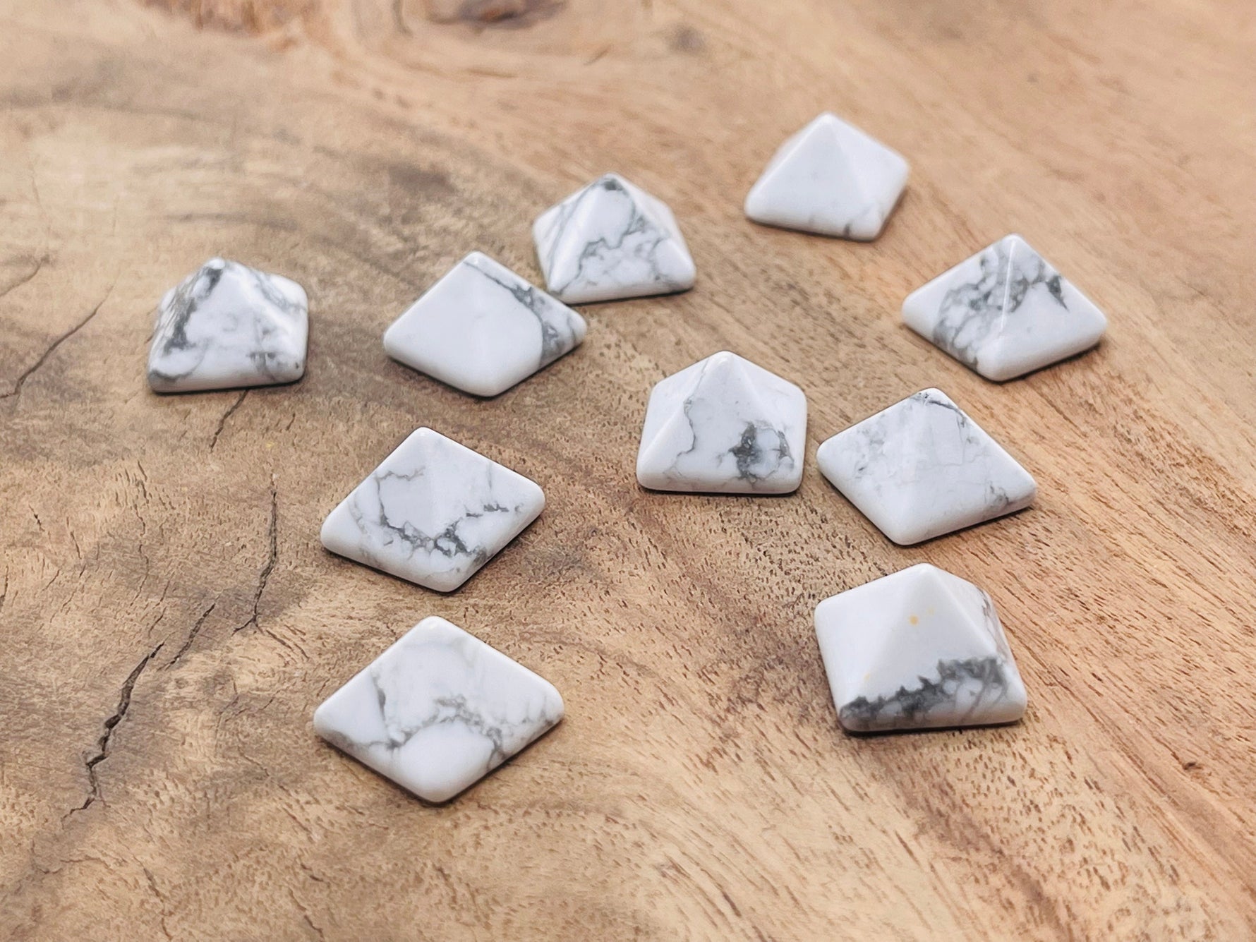 14mm Howlite pyramid gemstone carving by GemstoneGO, featuring a smooth white stone with gray veining and a pointed pyramid shape.