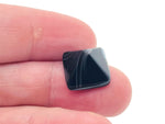 Black agate pyramid carving gemstone, 14mm, from GemstoneGO, showing a polished black stone with pyramid shape and detailed carvings.