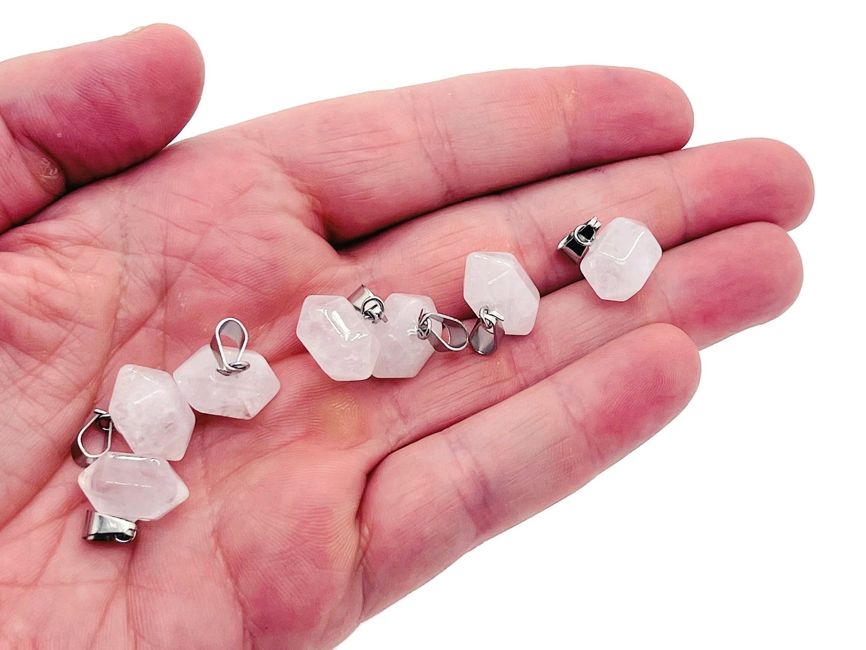Clear quartz point crystal pendant from GemstoneGO, showcasing a polished natural gemstone used in jewelry making.