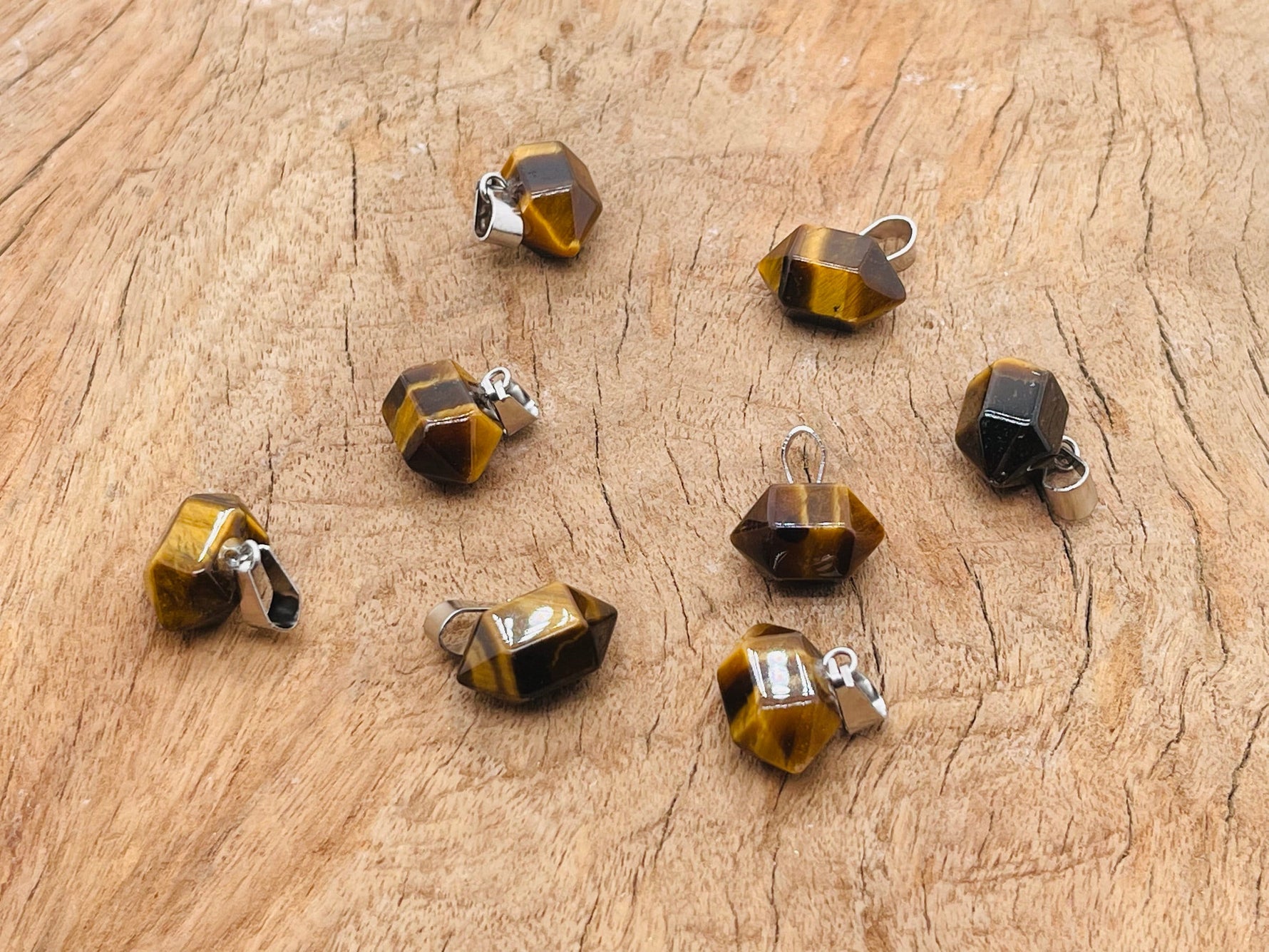 Tiger Eye Point Crystal pendant from GemstoneGO, showcasing a polished teardrop-shaped gemstone for jewelry making.