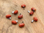 Red Jasper point crystal pendant from GemstoneGO, ideal for jewelry making, featuring a polished red jasper stone with natural gemstone details.