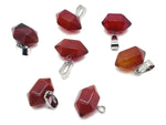 Carnelian point crystal pendant from GemstoneGO, gemstone for jewelry making, showcasing a vibrant orange-red stone with a pointed shape.