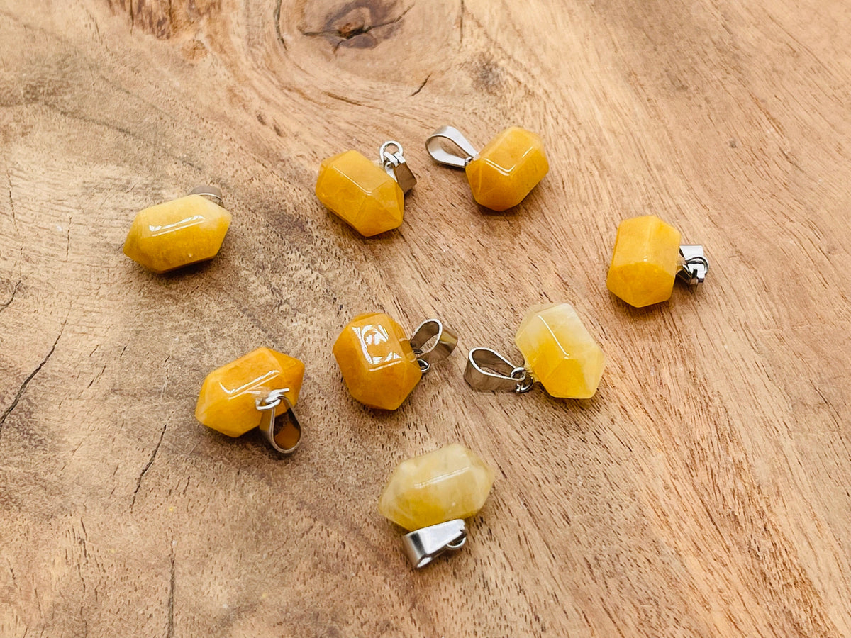 Yellow jade point crystal pendant by GemstoneGO, a polished gemstone jewelry making supply with a vibrant yellow hue.