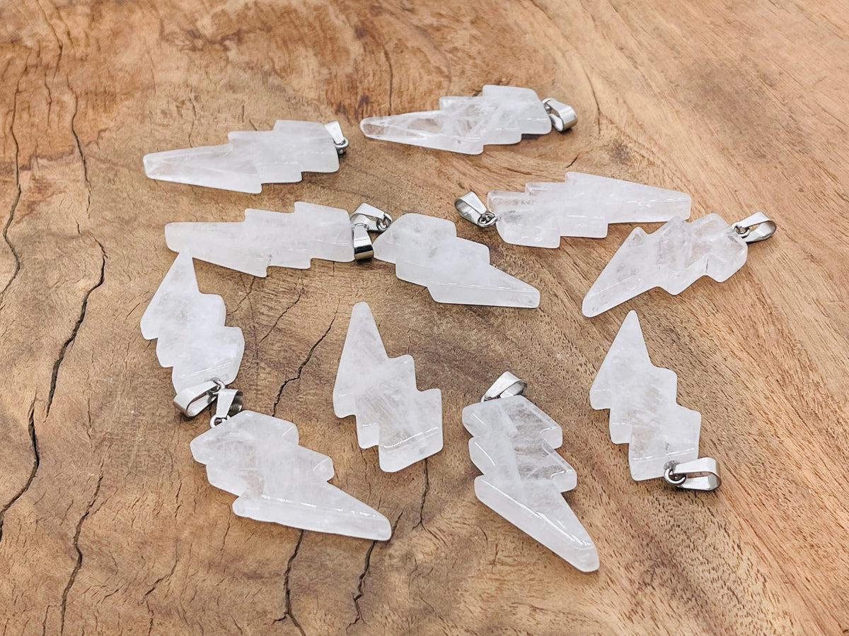 Rose Quartz lightning crystal pendant from GemstoneGO featuring a polished pink quartz crystal with a silver-tone setting.