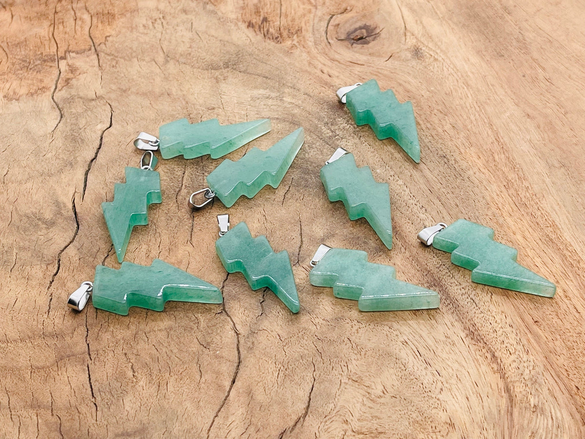 Aventurine lightning crystal pendant featuring a polished lightning stone wrapped in silver, showcasing vibrant green hues and intricate details.