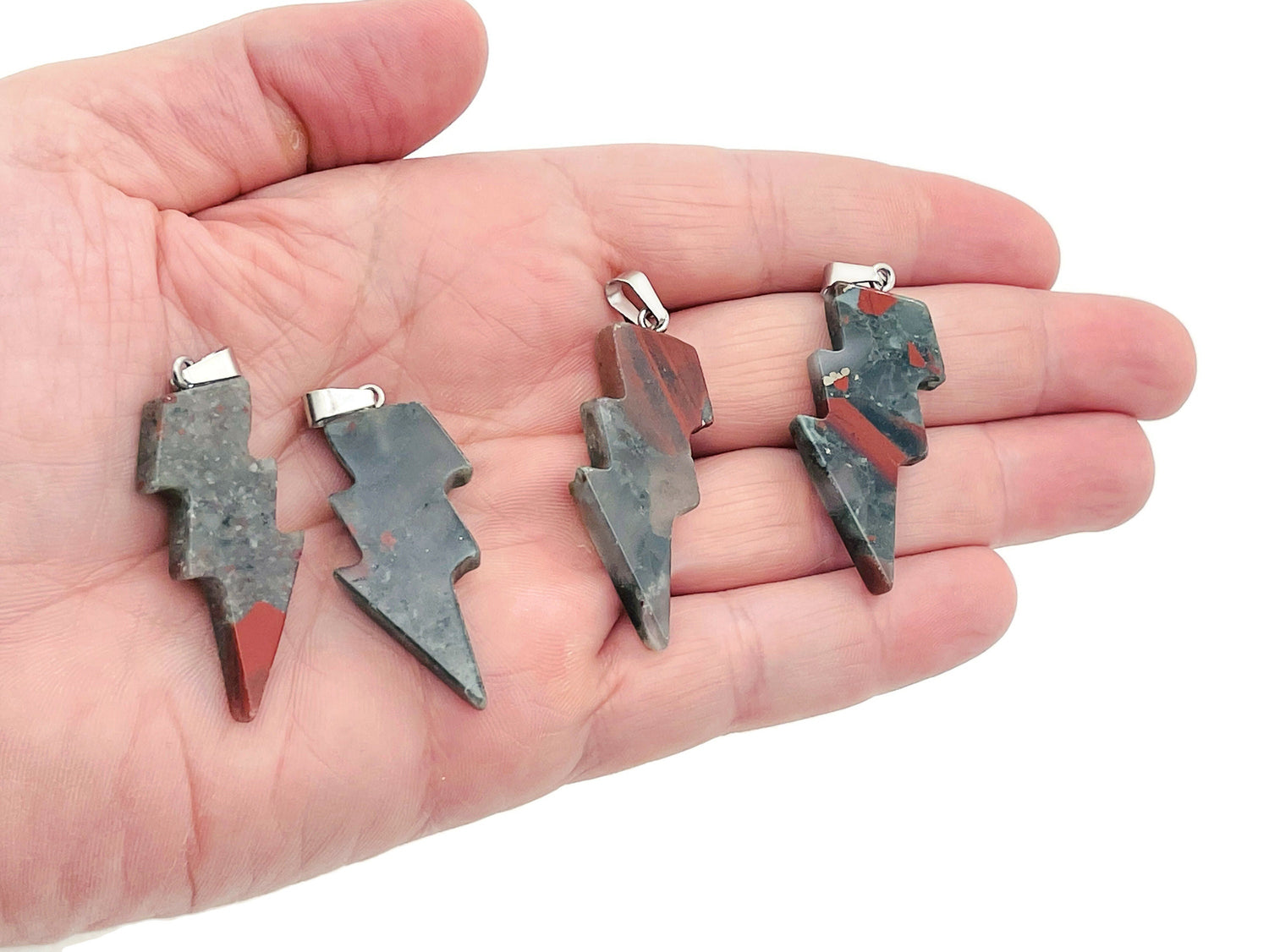 African Bloodstone Lightning Crystal Pendant featuring a striking lightning stone gemstone on a silver chain.