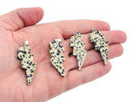 Dalmatian Jasper Lightning Crystal Pendant by GemstoneGO featuring a striking lightning stone design and natural gemstone details.