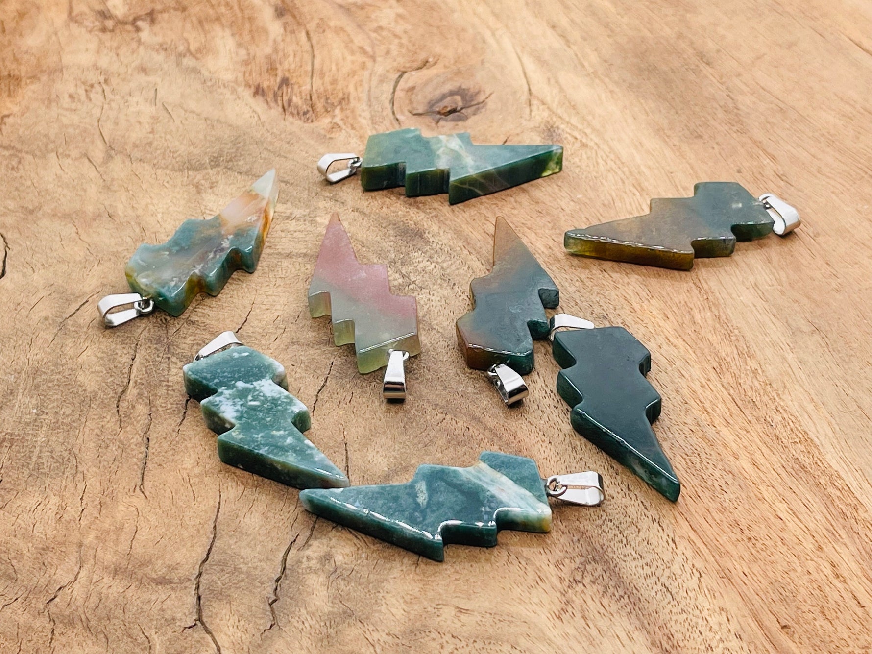 Moss agate lightning crystal pendant from GemstoneGO showcasing a natural lightning stone gemstone on a silver chain.