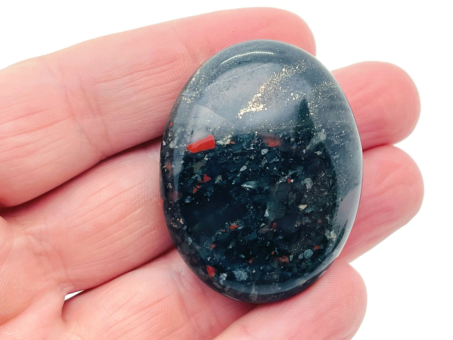 African Bloodstone palm gemstone spa stone, 45x35mm, with polished surface and natural red and green mineral patterns.