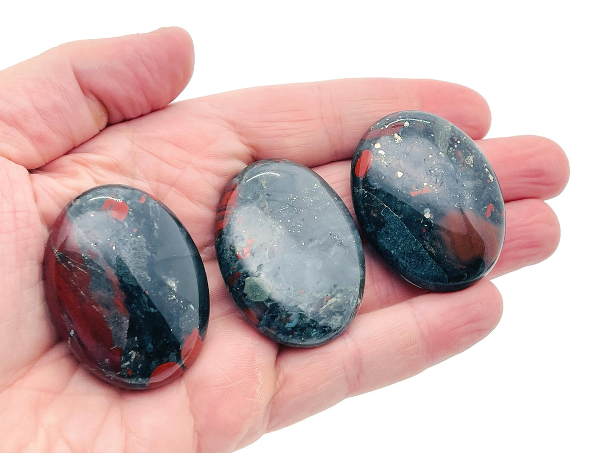 African Bloodstone palm gemstone spa stone, 45x35mm, polished natural healing stone from GemstoneGO, smooth and vibrant red-green mineral.