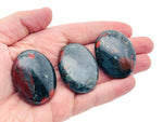 African Bloodstone palm gemstone spa stone, 45x35mm, polished natural healing stone from GemstoneGO, smooth and vibrant red-green mineral.