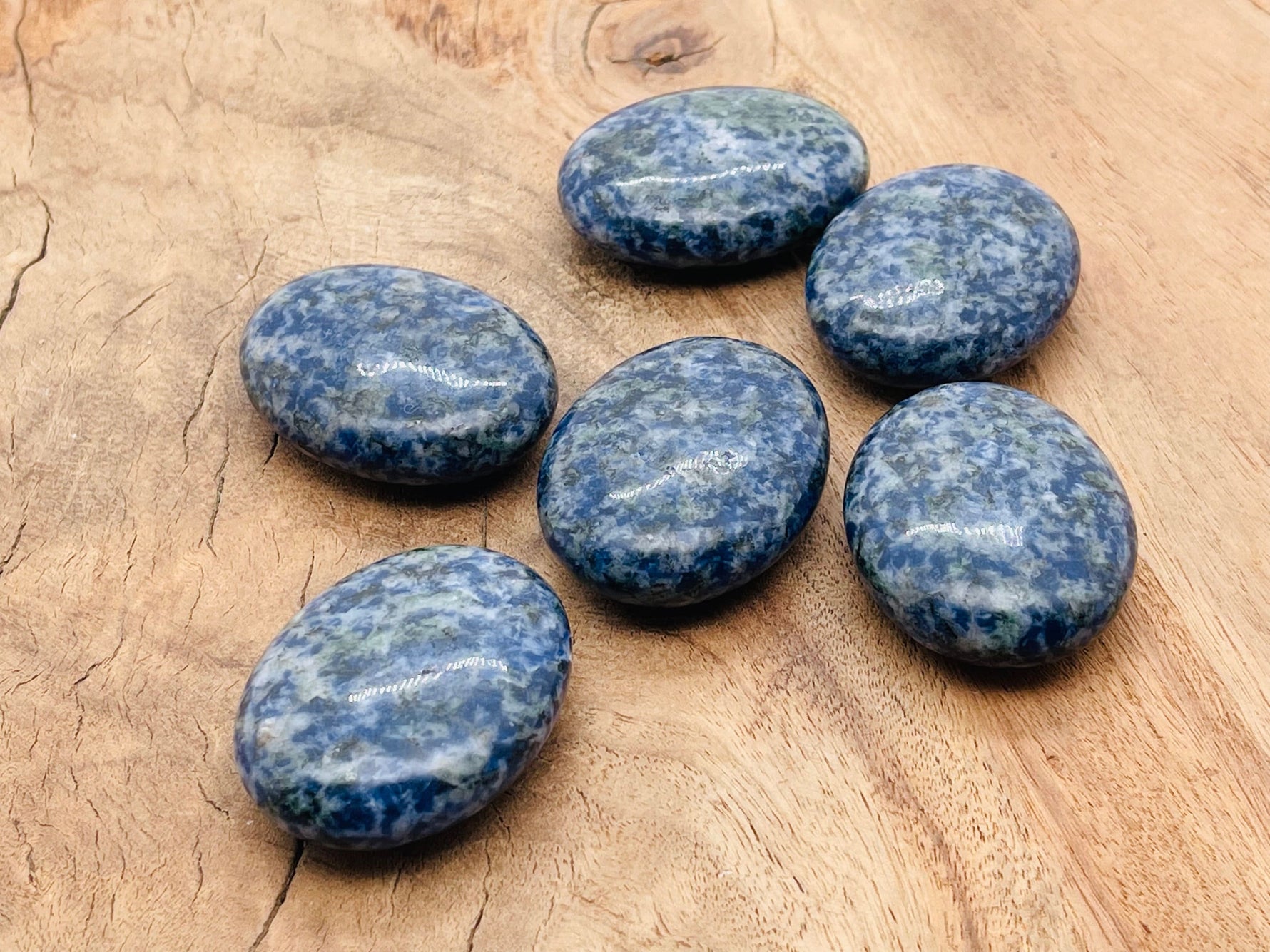 Blue Spot Jasper palm gemstone spa stone, 45x35mm, showcasing vibrant blue spots and smooth polished surface.